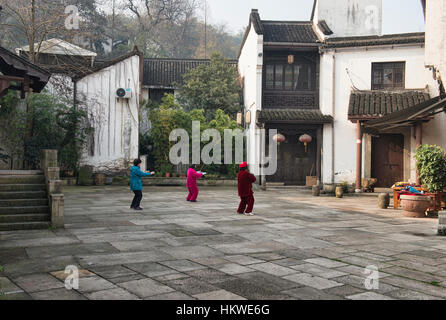 Women practicing tai chi, Hangzhou, China Stock Photo