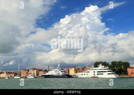 Superyachts Freedom and Lady S (IMO 8975067 and 1008217). Cumulonimbus cloud formation. Stock Photo