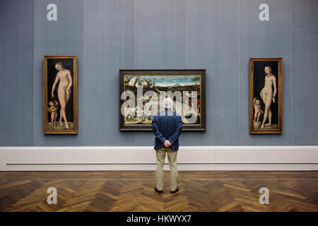 Berlin. Germany. A visitor looking at the work of Lucas Cranach the Elder in the Gemäldegalerie. Stock Photo