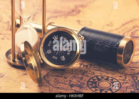 compass and nautical vintage equipment on old world map Stock Photo