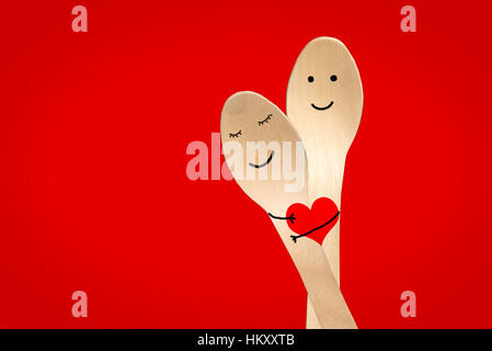Happy couple painted on spoons, valentines day panoramic red background ...