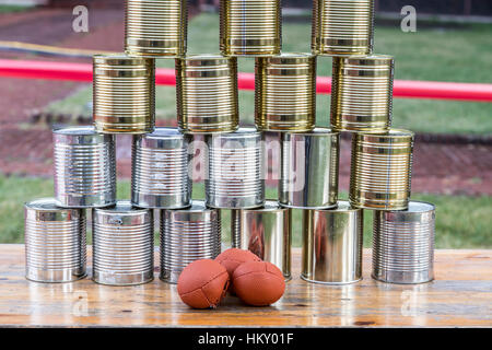 Cans, empty tin cans, built to a pyramid, at a children's party, throwing balls, Stock Photo