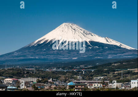 Japan. A snow capped Mount Fuji seen from the shinkansen (bullet train) between Kyoto and Tokyo Stock Photo