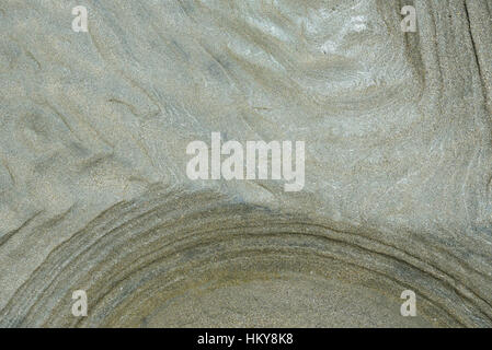 abstract curved lines on ocean wet sand Stock Photo
