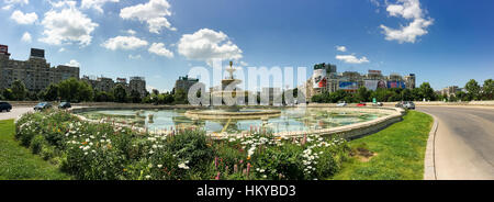 BUCHAREST, ROMANIA - MAY 28, 2016: Union Square Fountain And House Of The People Or Parliament Palace (Casa Poporului) View From Union Boulevard (Bule Stock Photo