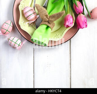 Easter table setting with fresh tulips and festive decoration, top view Stock Photo