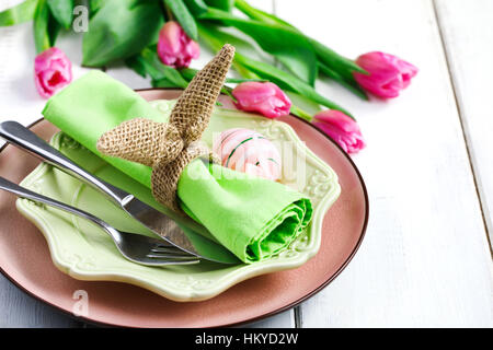 Easter table setting with fresh tulips Stock Photo