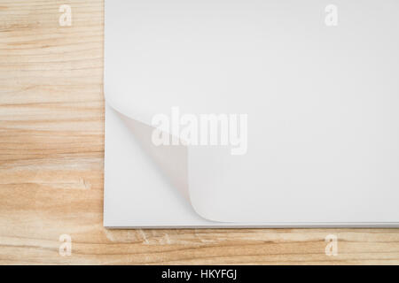 Real Paper Corner Fold on wood background Stock Photo