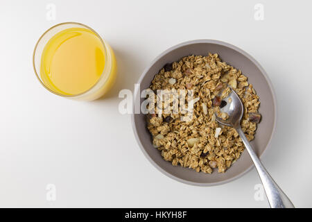 Cereal and orange juice breakfast setting Stock Photo