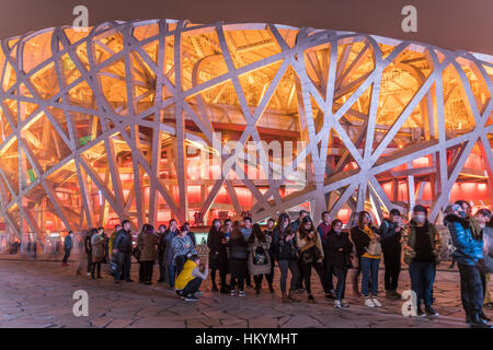 Audience waiting at the National Stadium at dusk, Olympic Park Beijing, People's Republic of China, Asia Stock Photo