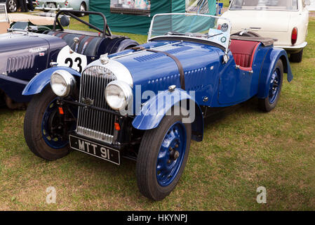 A blue, Series 1, 1950, Morgan 4/4 on display in the Morgan Sports Car Club Zone, at the 2016 Silverstone Classic Stock Photo