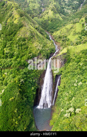 Aerial view of the Manawaiopuna Falls also known as the Jurassic Falls in the moutains in Kauai, Hawaii, USA.