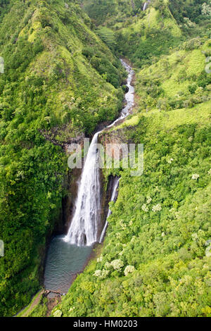 Aerial view of the Manawaiopuna Falls also known as the Jurassic Falls in the moutains in Kauai, Hawaii, USA.