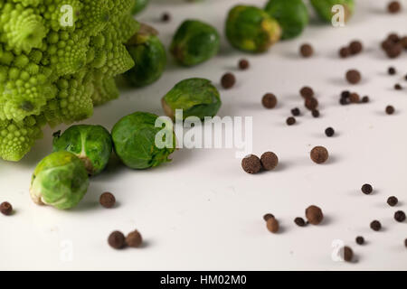 Fresh brusseles sprouts on a white surface Stock Photo