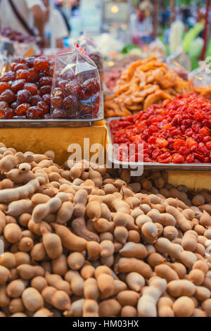 Tamarind and dried fruits on asian market, close up Stock Photo