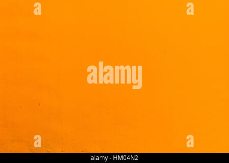 Orange Painted Wall, Concrete wall in orange yellow color paint Stock Photo