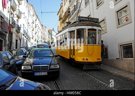 Tramway and Taxi in Calcada de Santo Andre, Alfama, Lisboa, Lisbon, Portugal Stock Photo