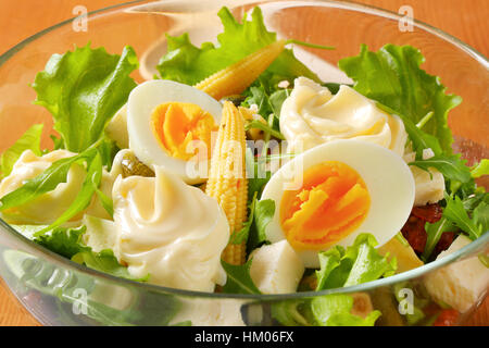bowl of mixed salad with eggs and baby corn - close up Stock Photo