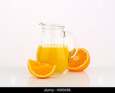 jug of fresh orange juice on white background Stock Photo