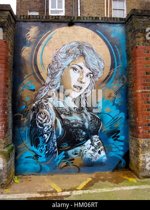 Blue & Gold painting by C215, Christian Guemy, in Shoreditch, London. Stock Photo