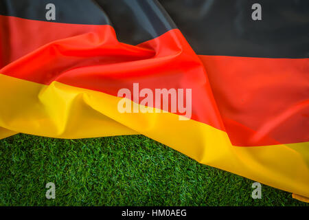 Flags of Germany on green grass Stock Photo