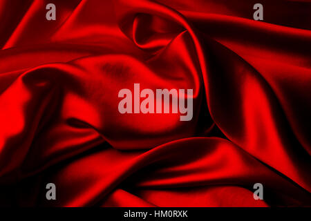 Closeup of ripples in red silk fabric Stock Photo