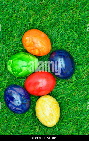 colorful easter eggs outside on green grass, close up Stock Photo
