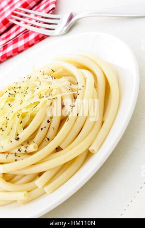 delicious italian plain bucatini  with italian herbs fresh butter and olive oil Stock Photo