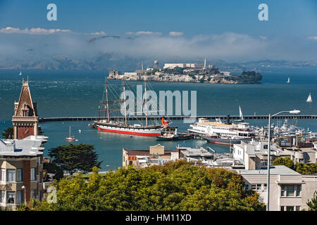 Alcatraz Island and  Balclutha ship, located in San Francisco Maritime National Historical Park, San Francisco, California USA Stock Photo