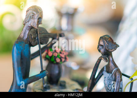 Statue of man playing violin with woman Stock Photo