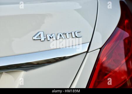 The rear end of a white Mercedes Benz C-300 luxury sedan Stock Photo