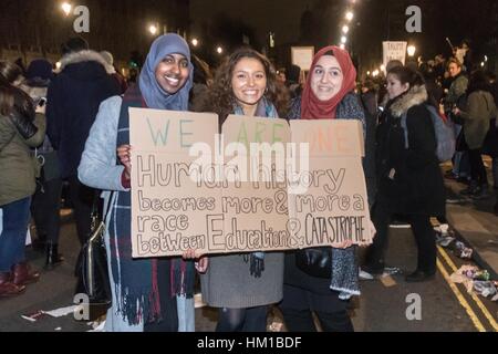 London, UK. 30th January, 2017. Tens of thousands protest outside the gates of Downing Street against an invitation by HM the Queen to US President Donald Trump for a state visit, a date for which has still to be set. The protests come following Trump's executive order for the temporary ban on Muslims and refugees from seven countries from entering the United States. A petition  against the visit has gathered well over a million signatures. Credit: Paul Davey/Alamy Live News Stock Photo