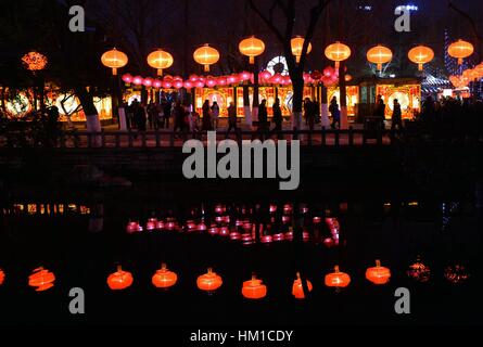 Jinan, China. 30th Jan, 2017. Tourists visit the 38th Baotu Spring ...