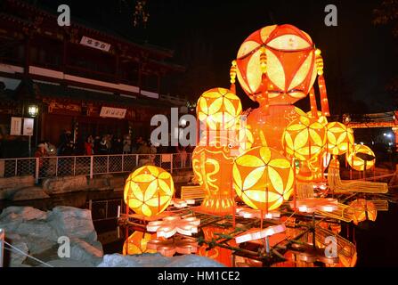Jinan, China. 30th Jan, 2017. Tourists visit the 38th Baotu Spring ...