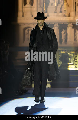A model walks the runway during the Saint Laurent Men Collection Fall ...