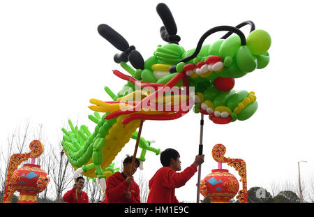 Wuhan, China's Hubei Province. 31st Jan, 2017. Participants perform dragon dance during a contest in Wuhan, capital of central China's Hubei Province, Jan. 31, 2017. Credit: Cheng Min/Xinhua/Alamy Live News Stock Photo