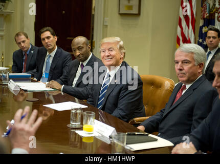 Washington DC, USA. 31st January 2017. United States President Donald Trump meets with representatives from PhRMA, the Pharmaceutical Research and Manufacturers of America in the in the Roosevelt Room of the White House in Washington, DC on Tuesday, January 31, 2017. According to its website PhRMA 'represents the country's leading biopharmaceutical researchers and biotechnology companies.' From left to right: Josh Pitcock, Chief of Staff to the Vice President; Stephen Ubl, President and CEO, PhARMA; Kenneth C. Frazier, Chairman and CEO of Merck & Co Credit: MediaPunch Inc/Alamy Live News Stock Photo