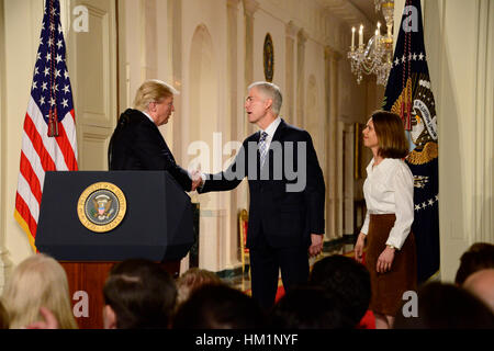 Washington, USA. 31st Jan, 2017. United States President Donald J. Trump (L) announces Neil Gorsuch as his nominee to be Associate Justice of the US Supreme Court to replace Justice Antonin Scalia in the East Room of the White House in Washington, DC on Tuesday, January 31, 2017. Gorsuch is accompanied by his wife Marie Louise (R). Credit: Ron Sachs/CNP - NO WIRE SERVICE - Photo: Ron Sachs/Consolidated/dpa/Alamy Live News Stock Photo