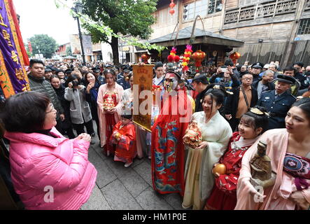 Fuzhou. 1st Feb, 2017. Performers in 'caishen', or the 'God of Wealth' costumes perform at the Three Lanes and Seven Alleys, a well-preserved historical architectural complex named as Sanfang Qixiang in Chinese, in Fuzhou, capital of southeast China's Fujian Province, Feb. 1, 2017, the fifth day into the new year which is believed to be the birthday of the God of Wealth. The 'God of Wealth' is believed to bring fortune to people. Credit: Lin Shanchuan/Xinhua/Alamy Live News Stock Photo