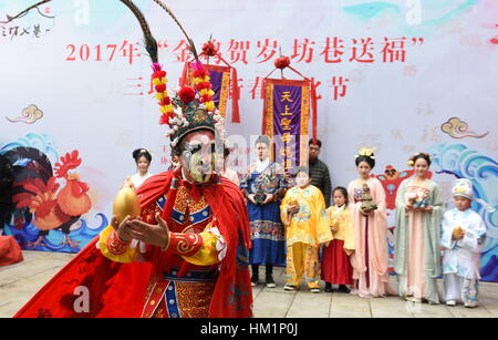 Fuzhou. 1st Feb, 2017. A performer in 'caishen', or the 'God of Wealth' costume performs at the Three Lanes and Seven Alleys, a well-preserved historical architectural complex named as Sanfang Qixiang in Chinese, in Fuzhou, capital of southeast China's Fujian Province, Feb. 1, 2017, the fifth day into the new year which is believed to be the birthday of the God of Wealth. The 'God of Wealth' is believed to bring fortune to people. Credit: Lin Shanchuan/Xinhua/Alamy Live News Stock Photo