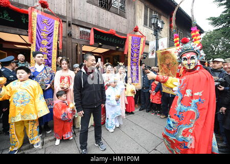 Fuzhou. 1st Feb, 2017. Performers in 'caishen', or the 'God of Wealth' costumes perform at the Three Lanes and Seven Alleys, a well-preserved historical architectural complex named as Sanfang Qixiang in Chinese, in Fuzhou, capital of southeast China's Fujian Province, Feb. 1, 2017, the fifth day into the new year which is believed to be the birthday of the God of Wealth. The 'God of Wealth' is believed to bring fortune to people. Credit: Lin Shanchuan/Xinhua/Alamy Live News Stock Photo