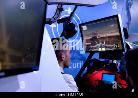 Tel Aviv, Israel. 31st Jan, 2017. Israeli man navigating virtual combat aircraft in a flight simulator run by Cisco Meraki IT company at the Cybertech 2017 the second largest exhibition of cyber technologies worldwide taking place in Tel Aviv on 31 January 2017. Israel's rise as one of the world's leaders in cybersecurity has been boosted by cooperation between the military, government, education, and private sectors, a level of partnership unmatched in the Western world. Credit: Eddie Gerald/Alamy Live News Stock Photo