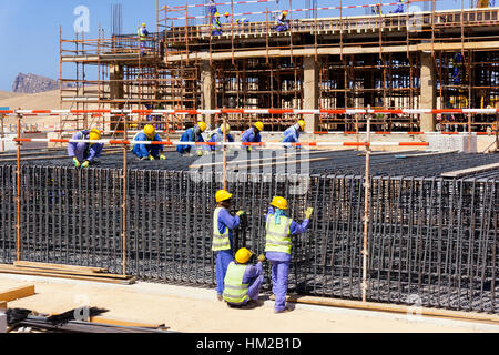 Construction workers prepararing rebars for concrete foundation Stock Photo