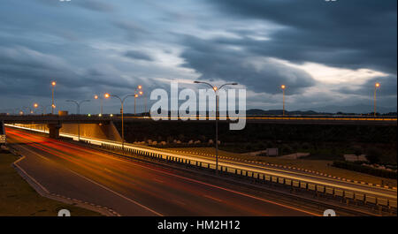 Light trails from cars moving fast late in the evening on a motorway of Nicosia, Cyprus. Concept of high speed. Stock Photo