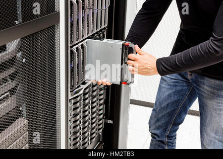 Male Computer Engineer Installing Blade Server In Chassis Stock Photo