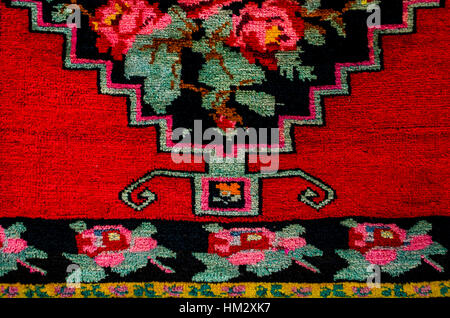 Border and middle part carpet with red roses on black background Stock Photo