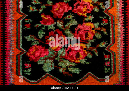 The middle carpet with bouquet of red roses on dark blue background Stock Photo