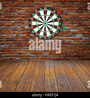 Dartboard on brick wall (miss darts) Stock Photo