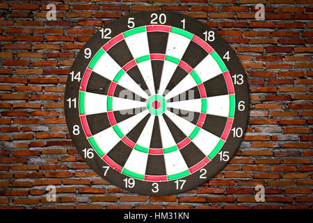 Dartboard on brick wall (miss darts) Stock Photo