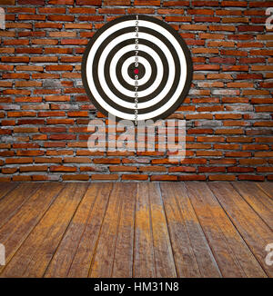 Dartboard on brick wall (Darts Hit Target) Stock Photo